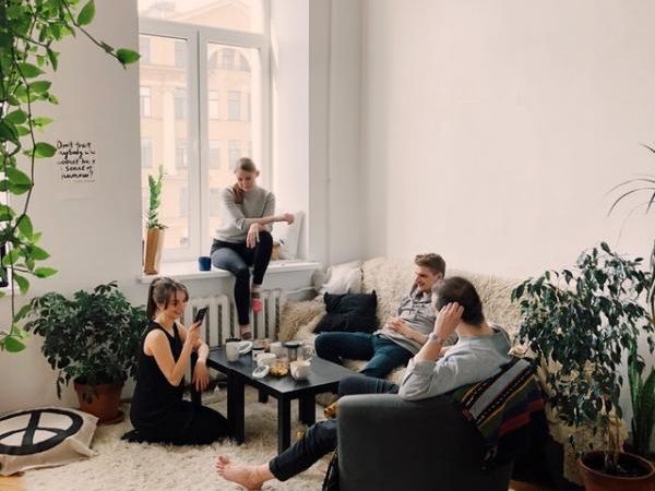 people-gathered-inside-house-sitting-on-sofa-1054974.jpg