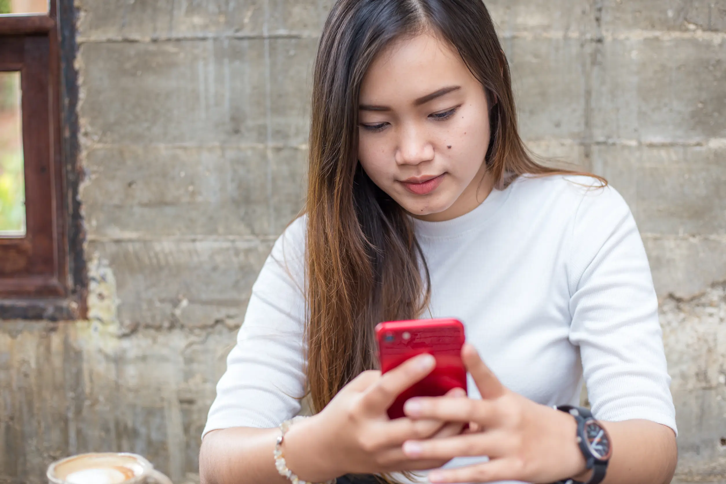 Girl Holding Phone.webp